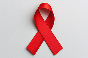 image of a red ribbon represents awareness and support for important health causes