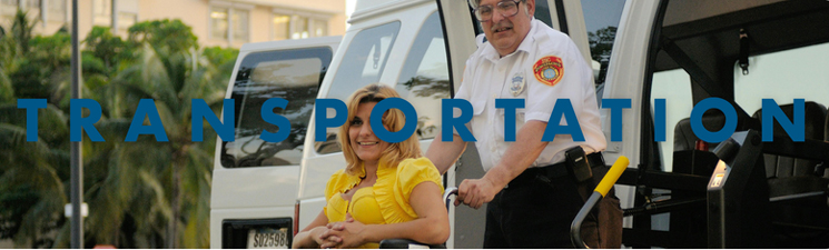 A woman being pushed in a wheel chair by a man in uniform.